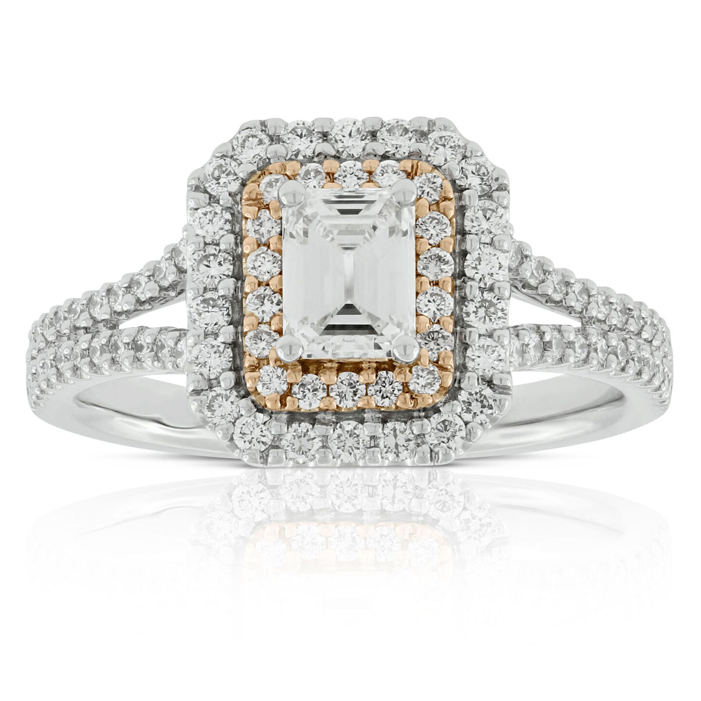 Emerald cut halo diamond ring against a white background