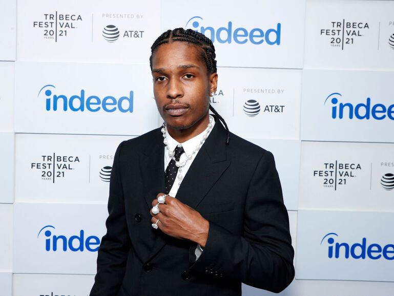 A$AP Rocky wearing a suit with pearl jewelry on the red carpet